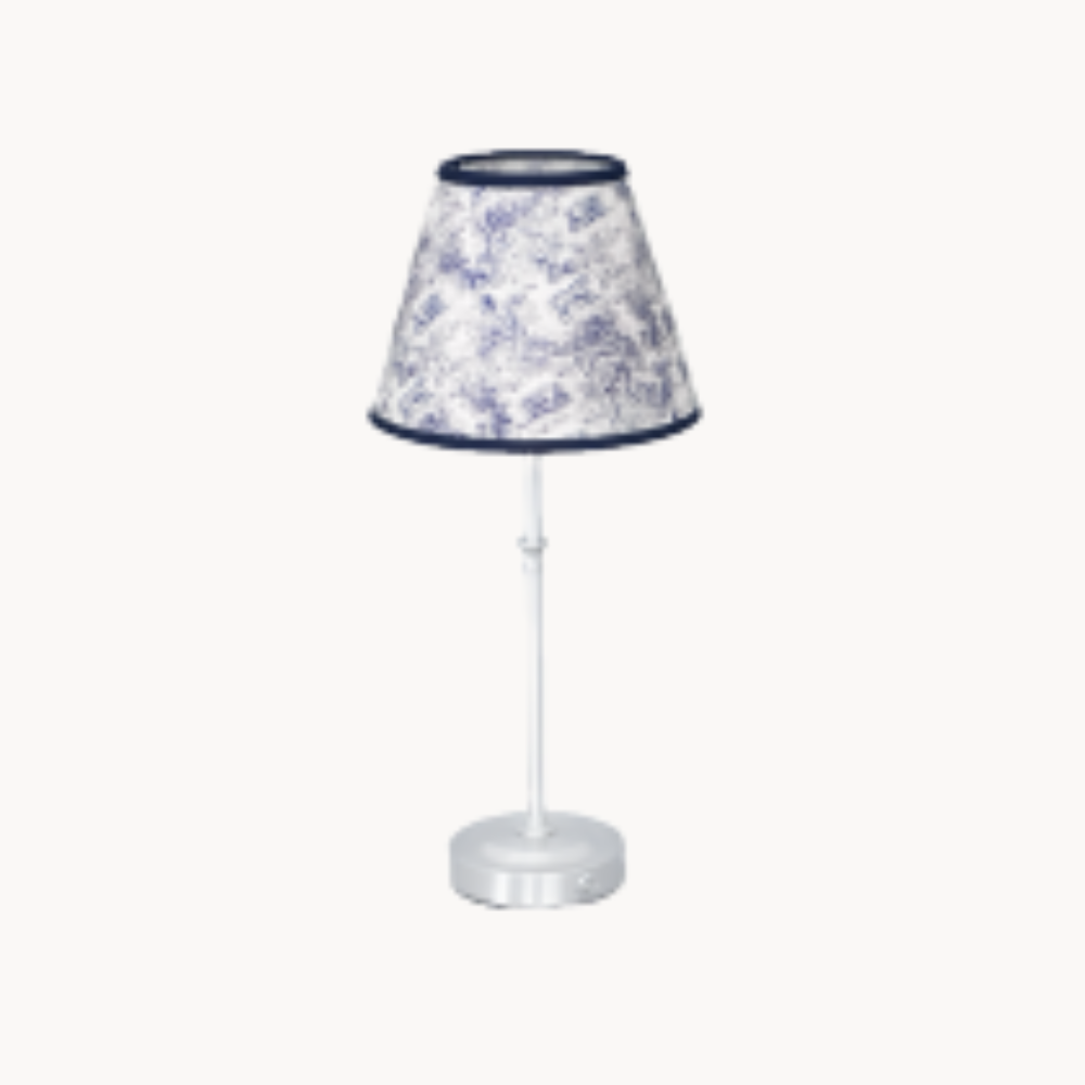 White lamp with blue patterned shade.