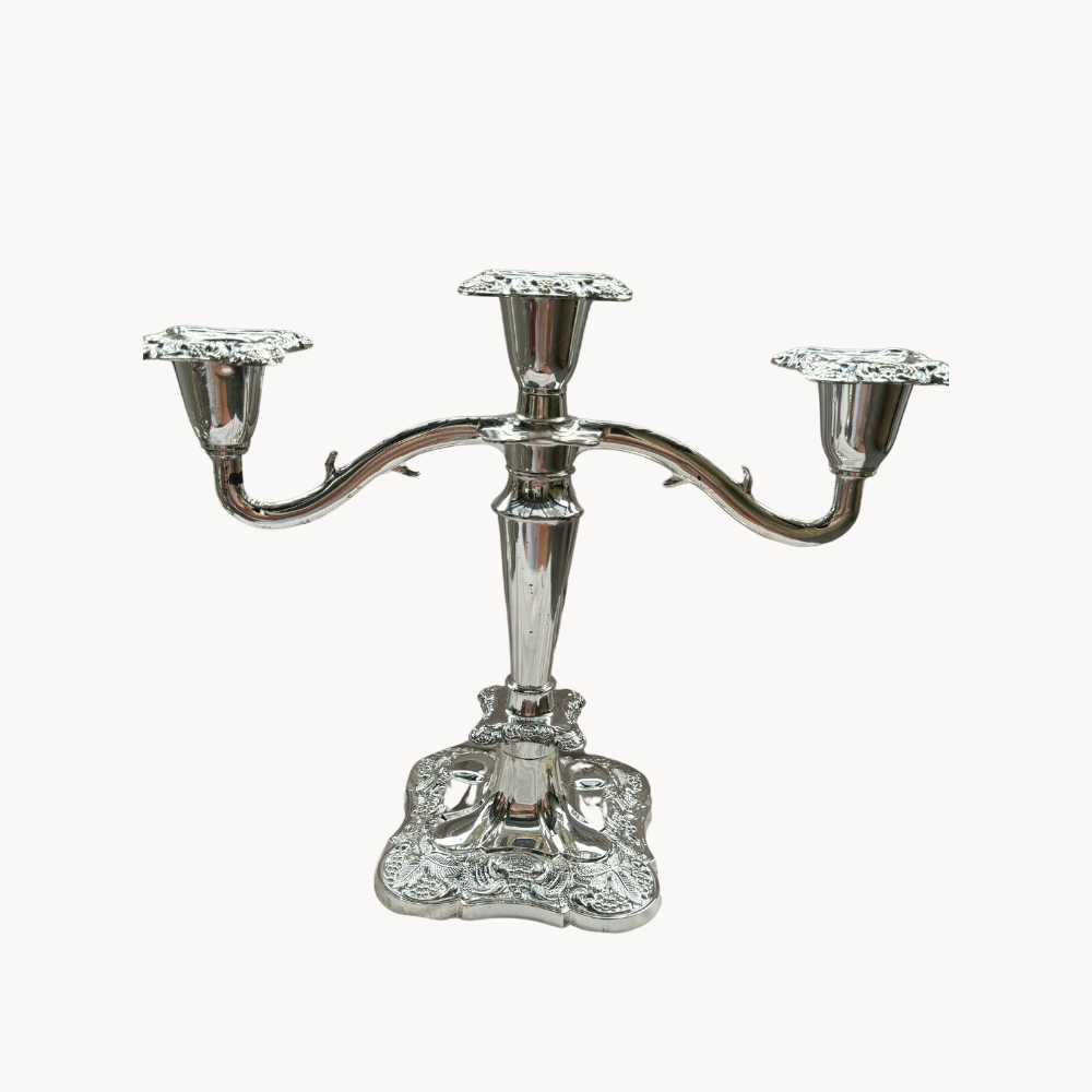 Ornate silver three-arm candelabra