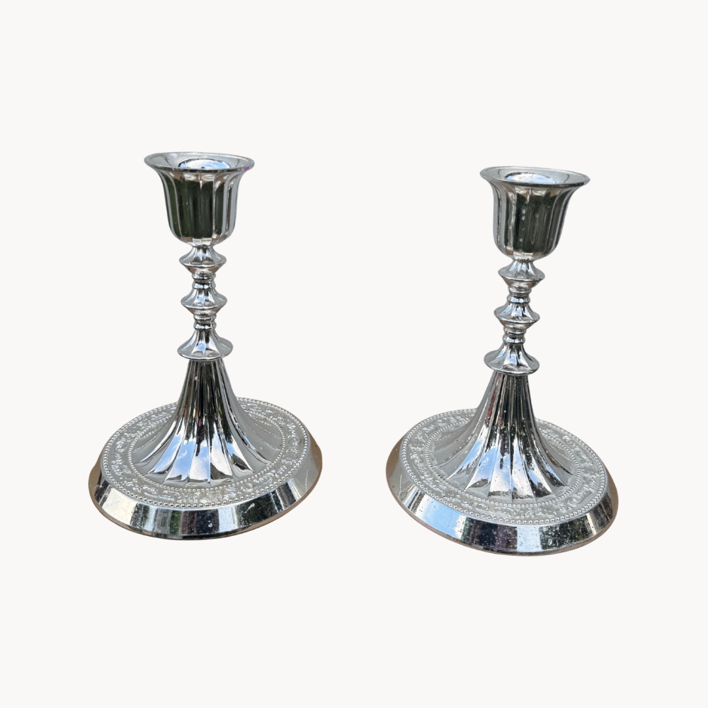 A pair of silverplate candlesticks