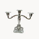 Ornate silver three-arm candelabra