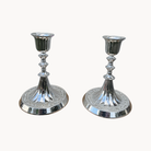A pair of silverplate candlesticks